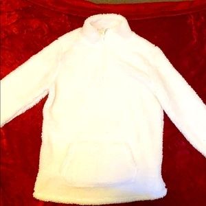 Fluffy white zip up jacket.